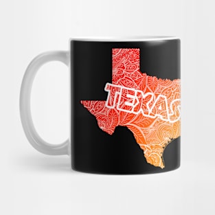 Colorful mandala art map of Texas with text in red and orange Mug